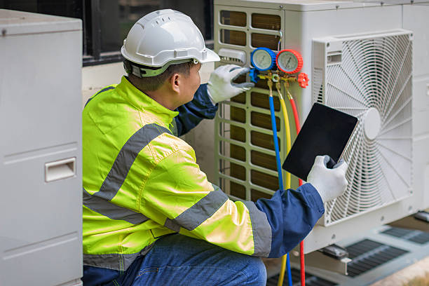 Professional Heat Pump Repair technician working in Mentone, IN